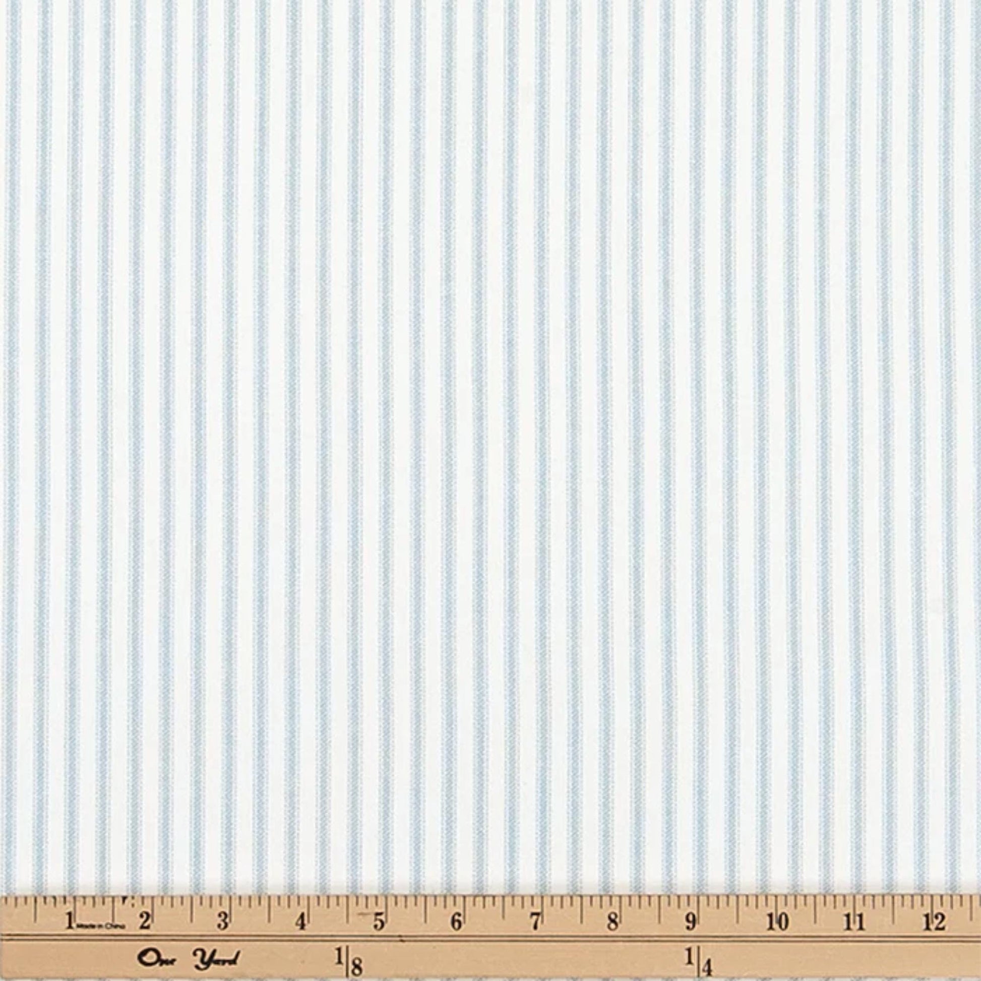 a ruler with a blue and white striped fabric