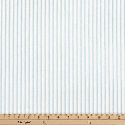 a ruler with a blue and white striped fabric