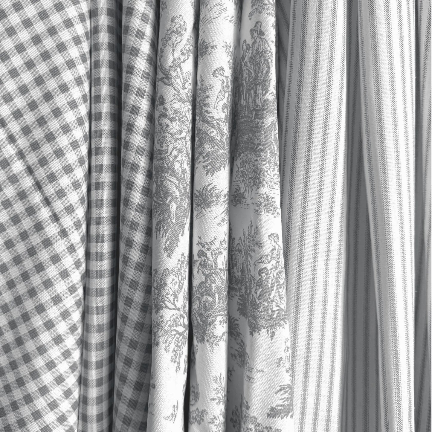 a close-up view of several fabric swatches, including a checkered fabric, a striped fabric, and a fabric with a floral pattern.