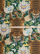 Scale reference with a ruler measuring the width of the tiger motif on emerald green chinoiserie fabric.