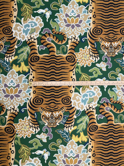 Scale reference with a ruler measuring the width of the tiger motif on emerald green chinoiserie fabric.