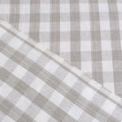 Taupe gingham linen fabric rolled in drapery weight
