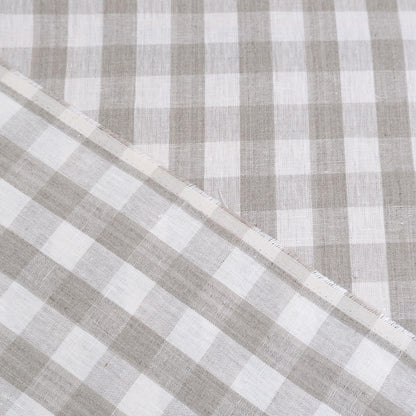 Taupe gingham linen fabric rolled in drapery weight