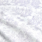 The image is a close-up of a fabric with a repeating pattern of a landscape scene, featuring people, animals, and various elements such as trees, flowers, and birds. The pattern is predominantly white, with some gray accents. The fabric appears to be made of a soft, plush material, suitable for clothing or home decor.