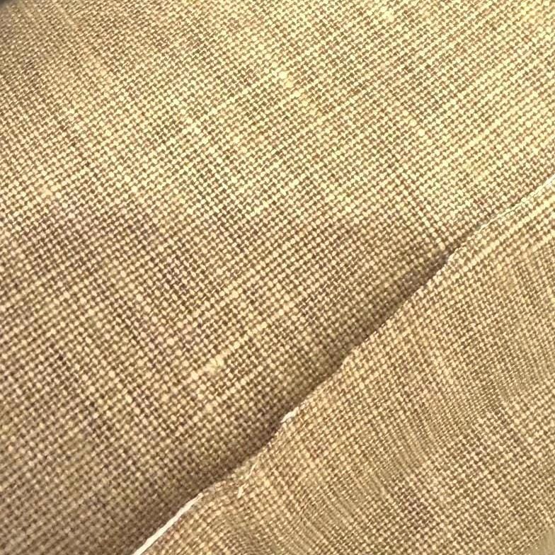 a close up of a chair with a black cushion