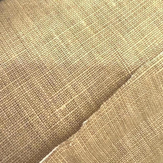 a close up of a chair with a black cushion
