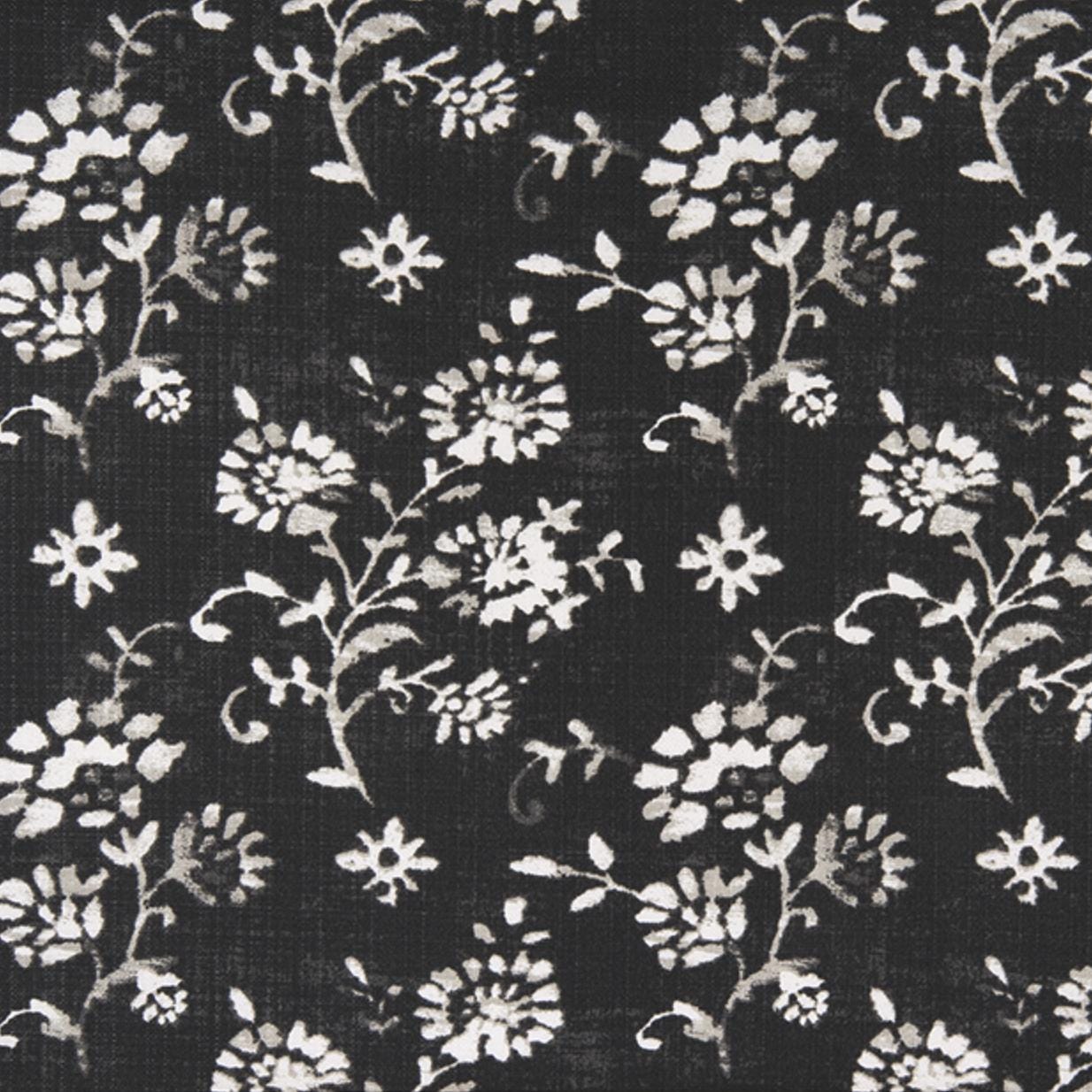 Close-up of black fabric with small white wildflower botanical print